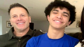 Stepdad and stepson smiling next to each other