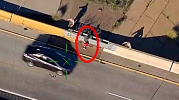A car drives by a child running on the shoulder of a highway ramp as two police officers give chase.