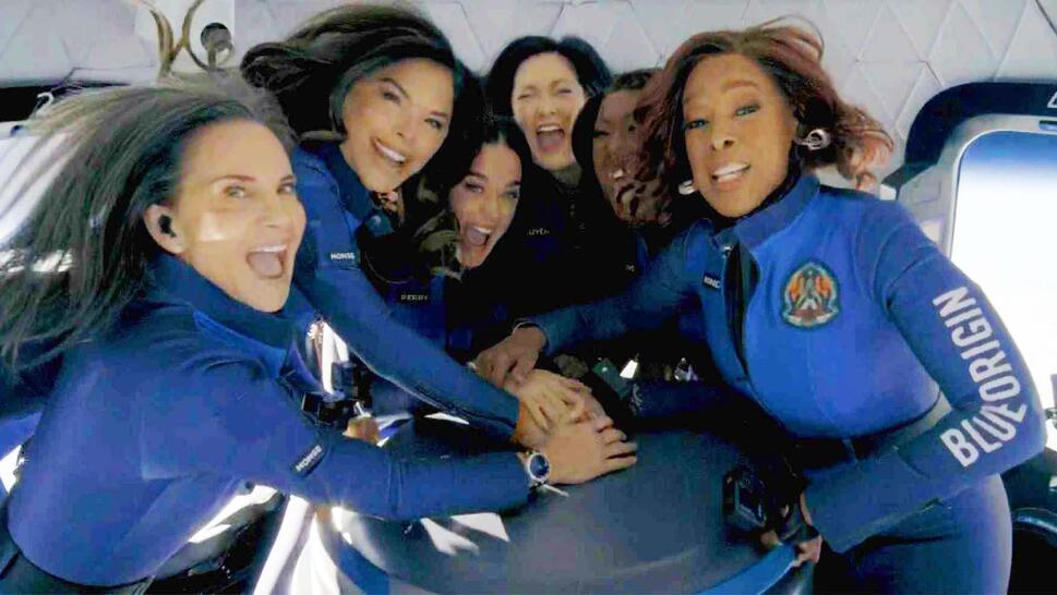 6 women huddled in a space ship